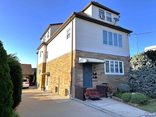 a front view of a house with parking