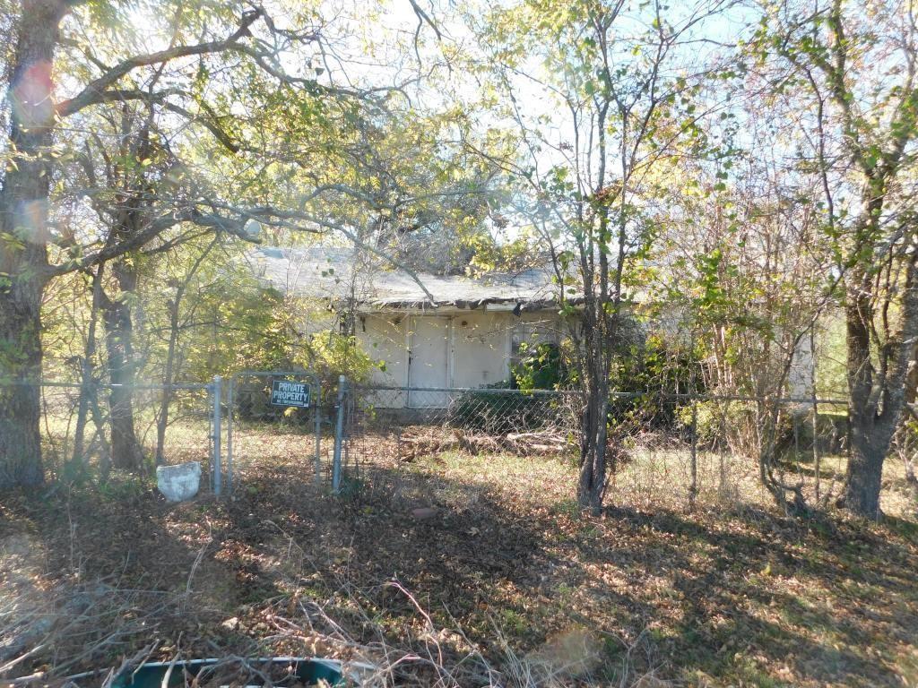 a view of a house with a tree