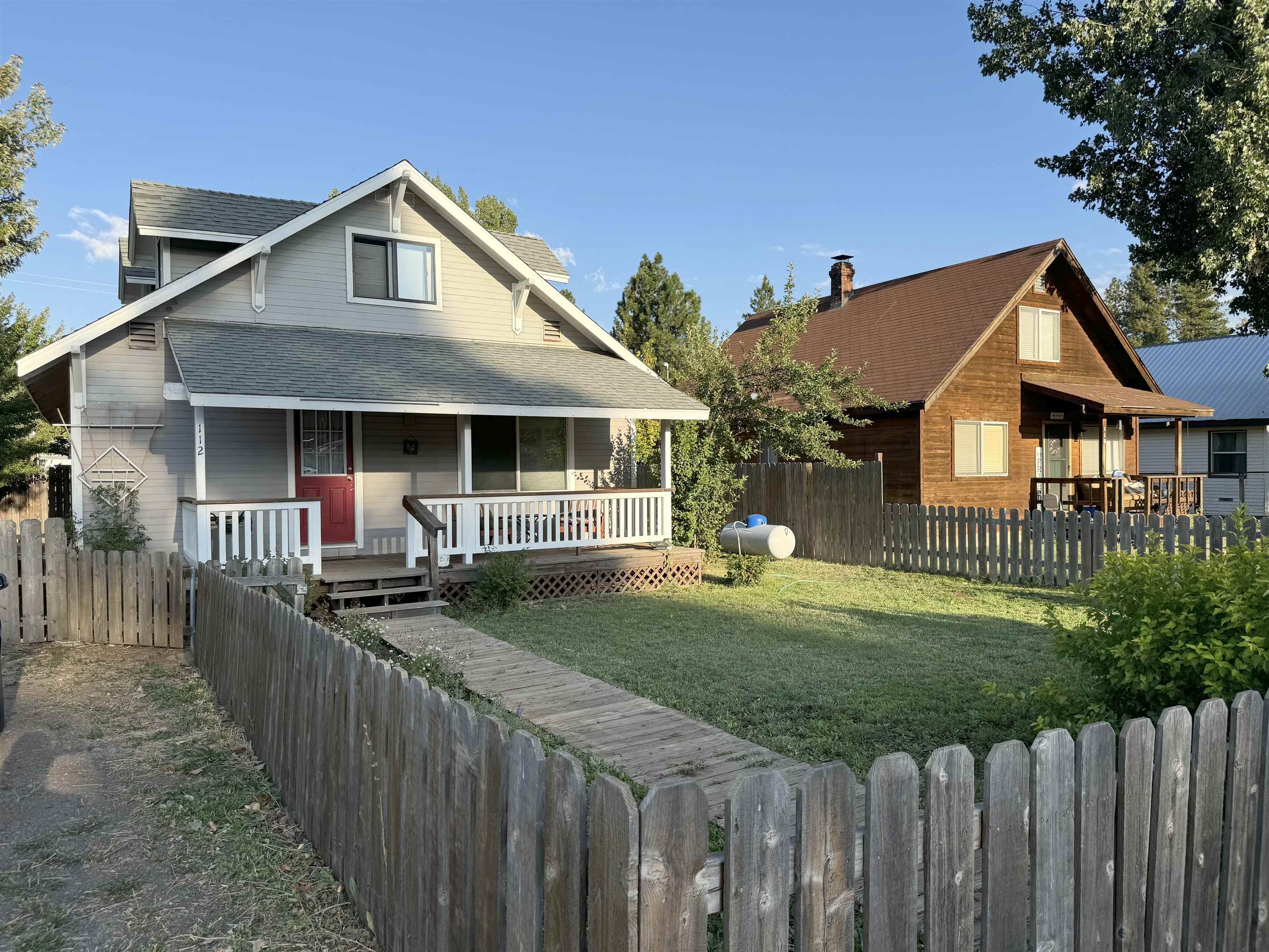 a front view of a house with yard