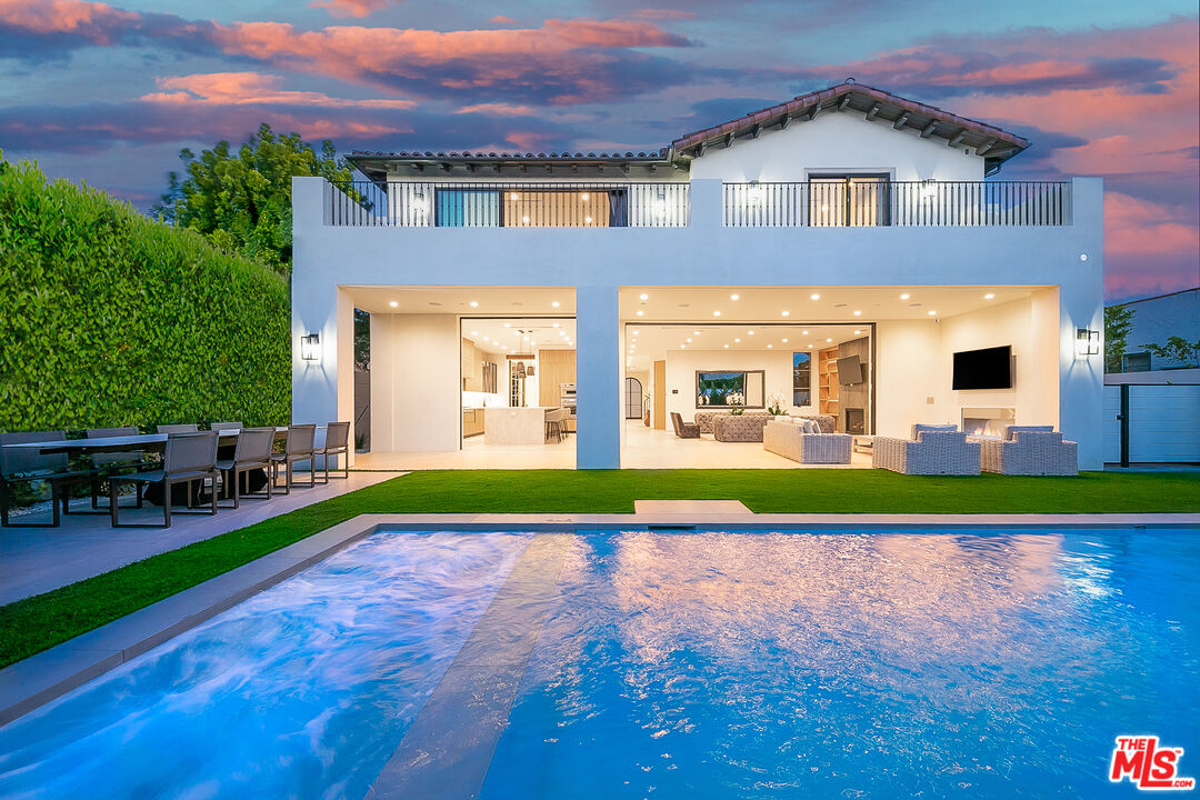 a view of pool with a yard