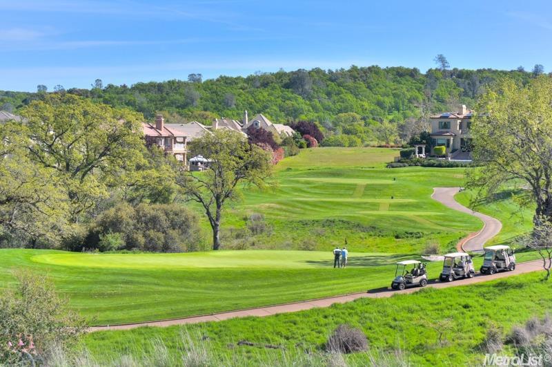 a view of a golf course with a park