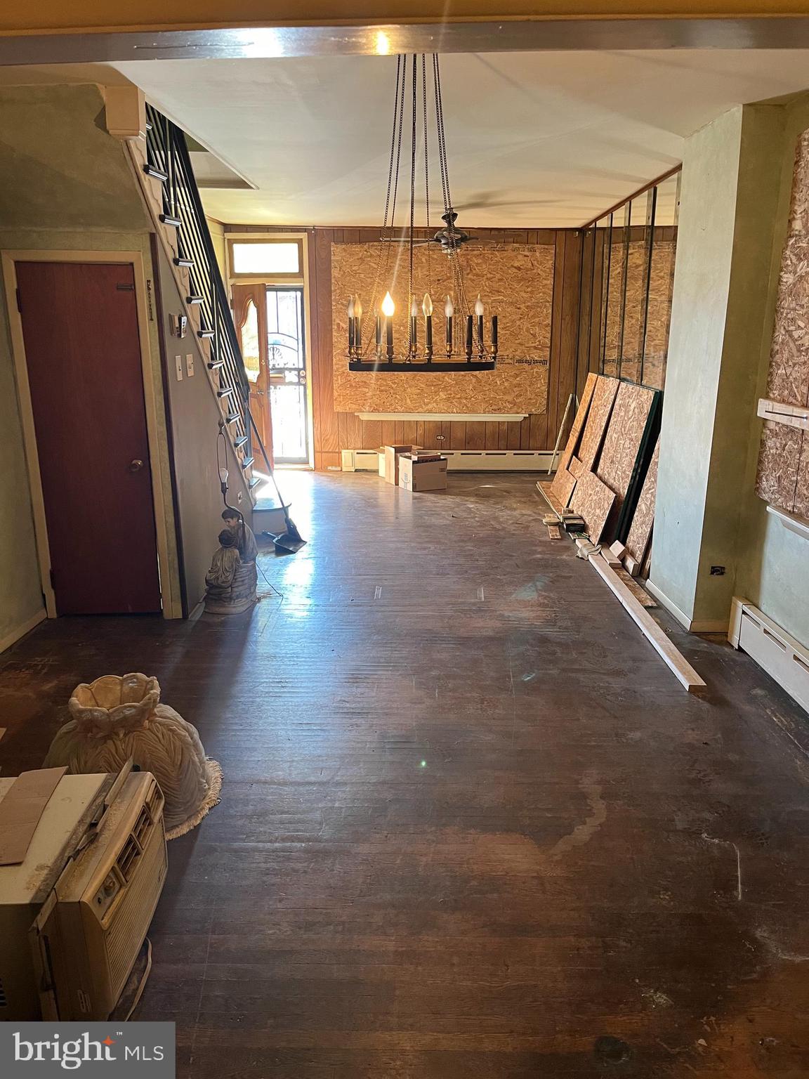 a view of an entryway with wooden floor