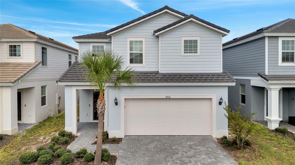 a front view of a house with a garage