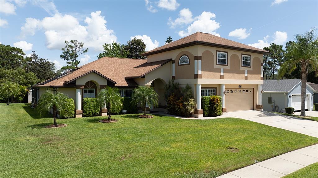 a front view of a house with a yard