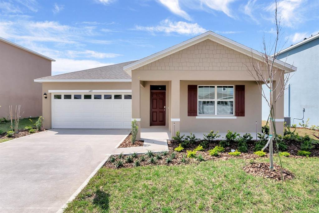 a front view of a house with a yard