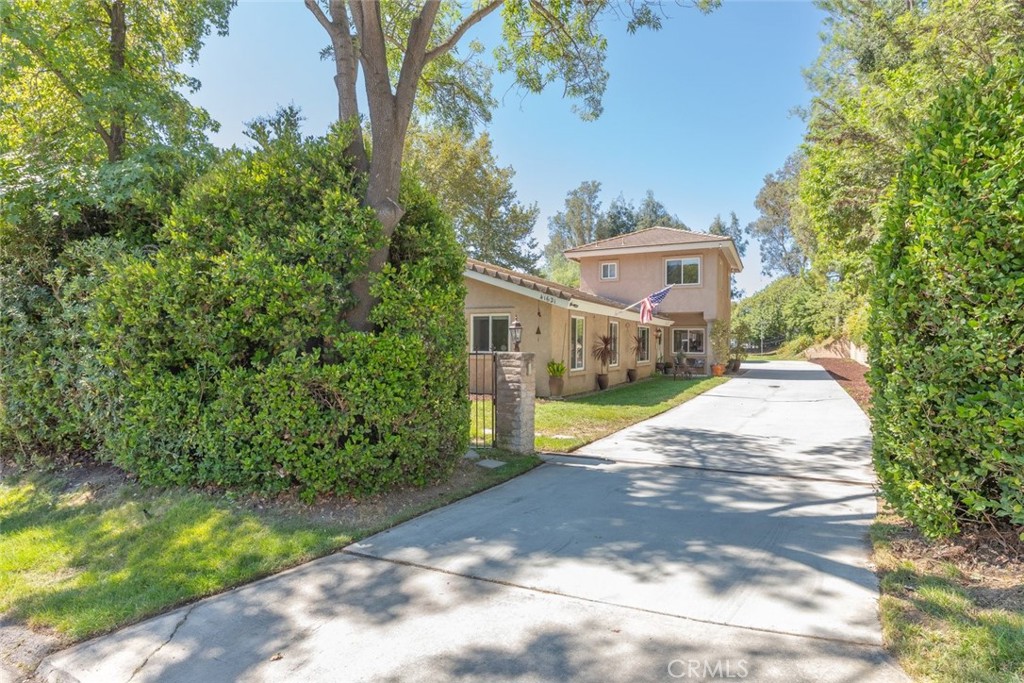 Long flat driveway for plenty of parking. Has Electronic gate.