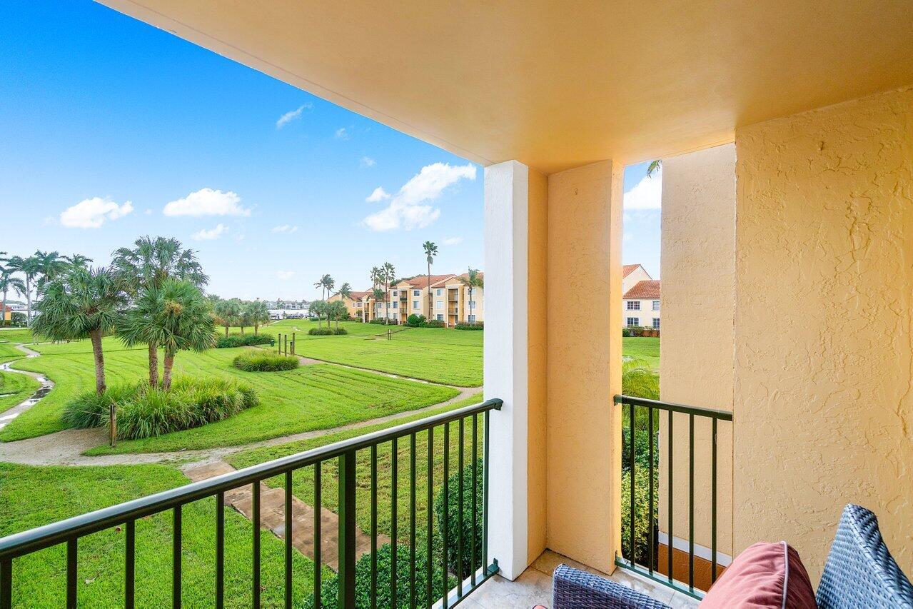 a view of a balcony with two chairs