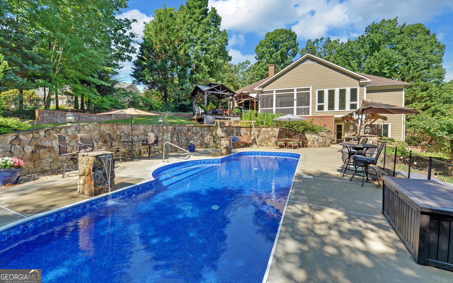 a front view of a house with swimming pool