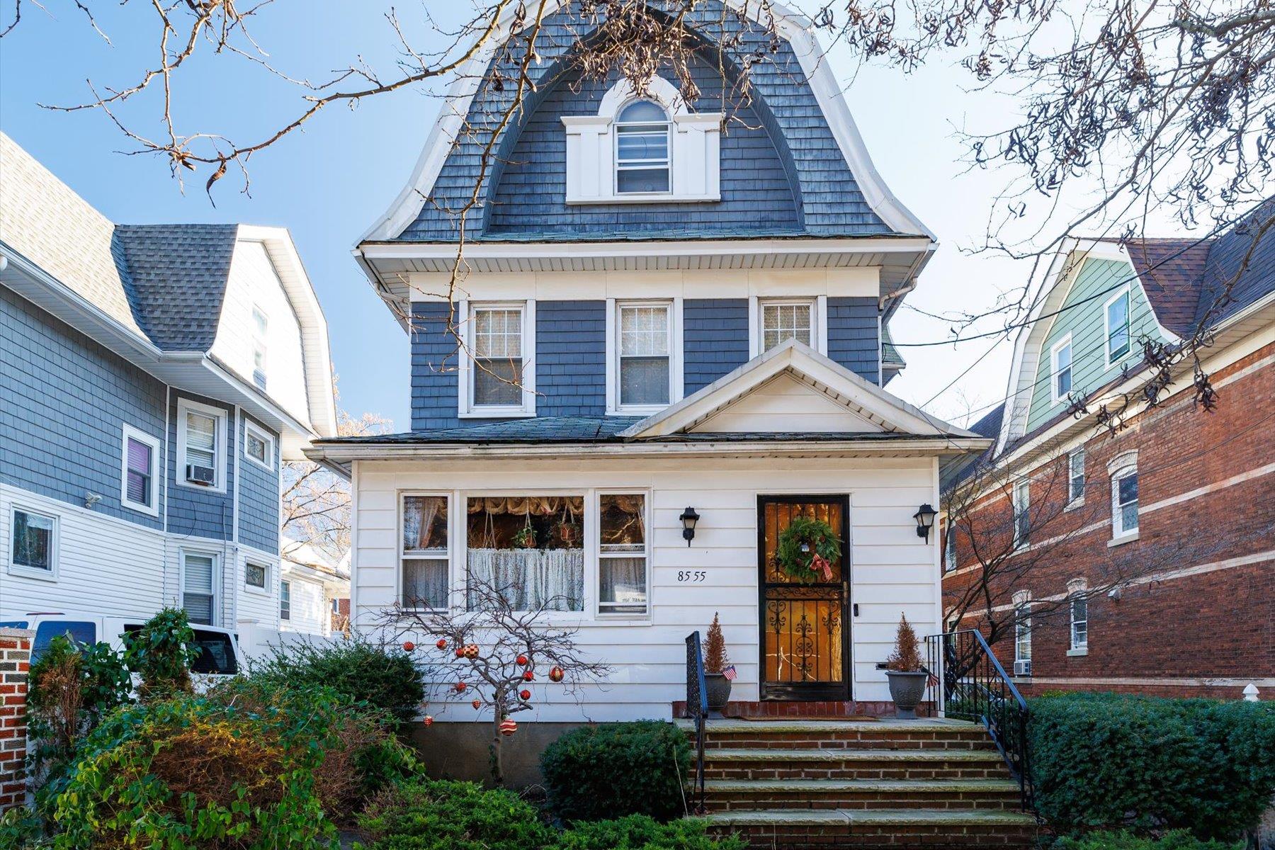 a front view of a house with garden