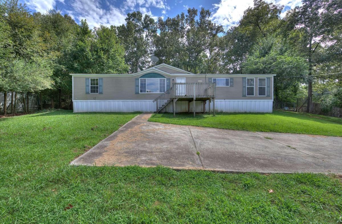 a view of a back yard with green space