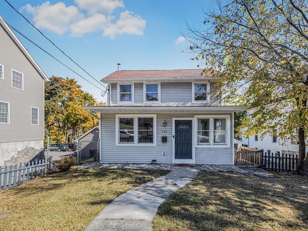 View of front of property with a front lawn