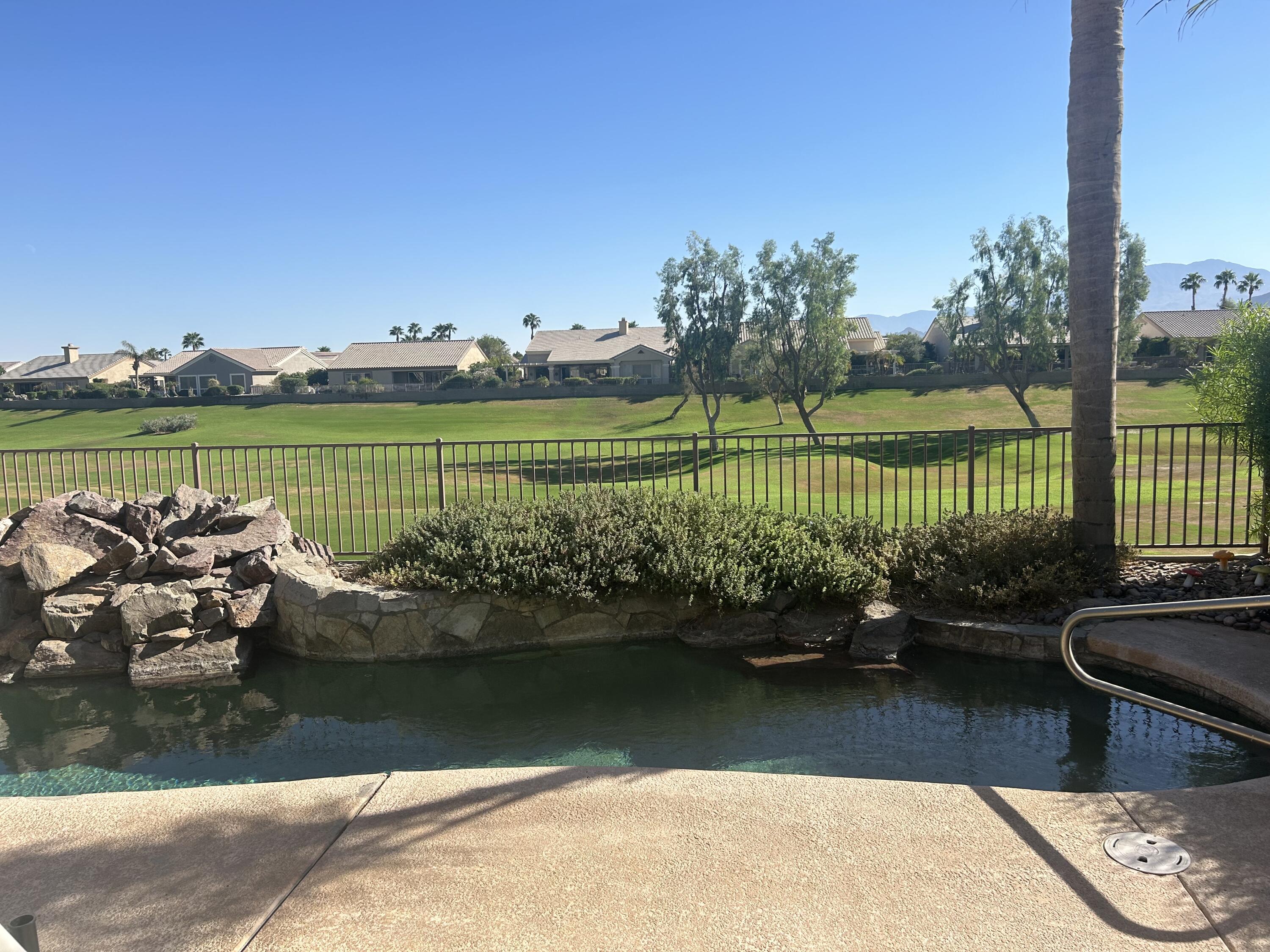 a view of a lake with a garden