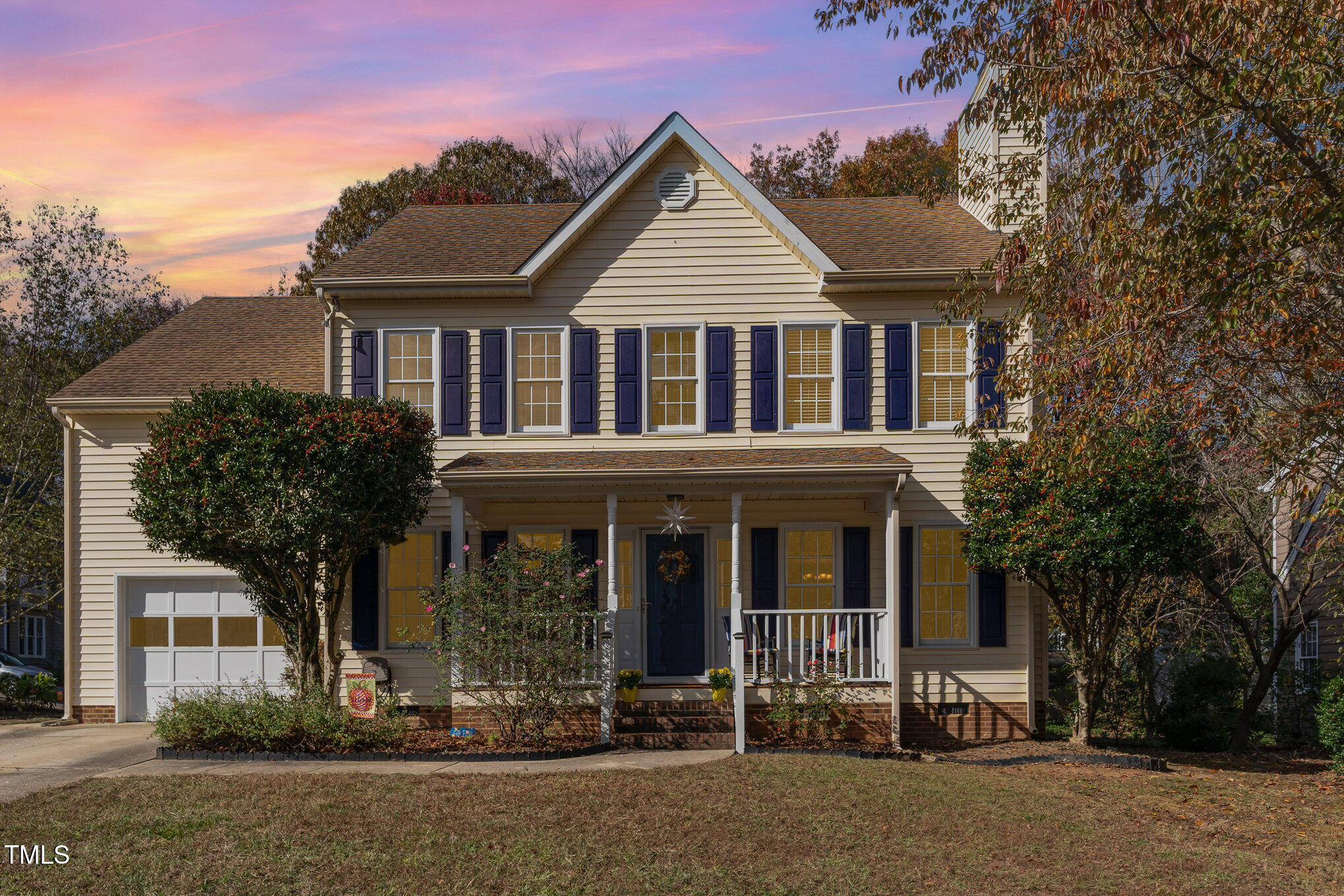 front view of a house with a yard