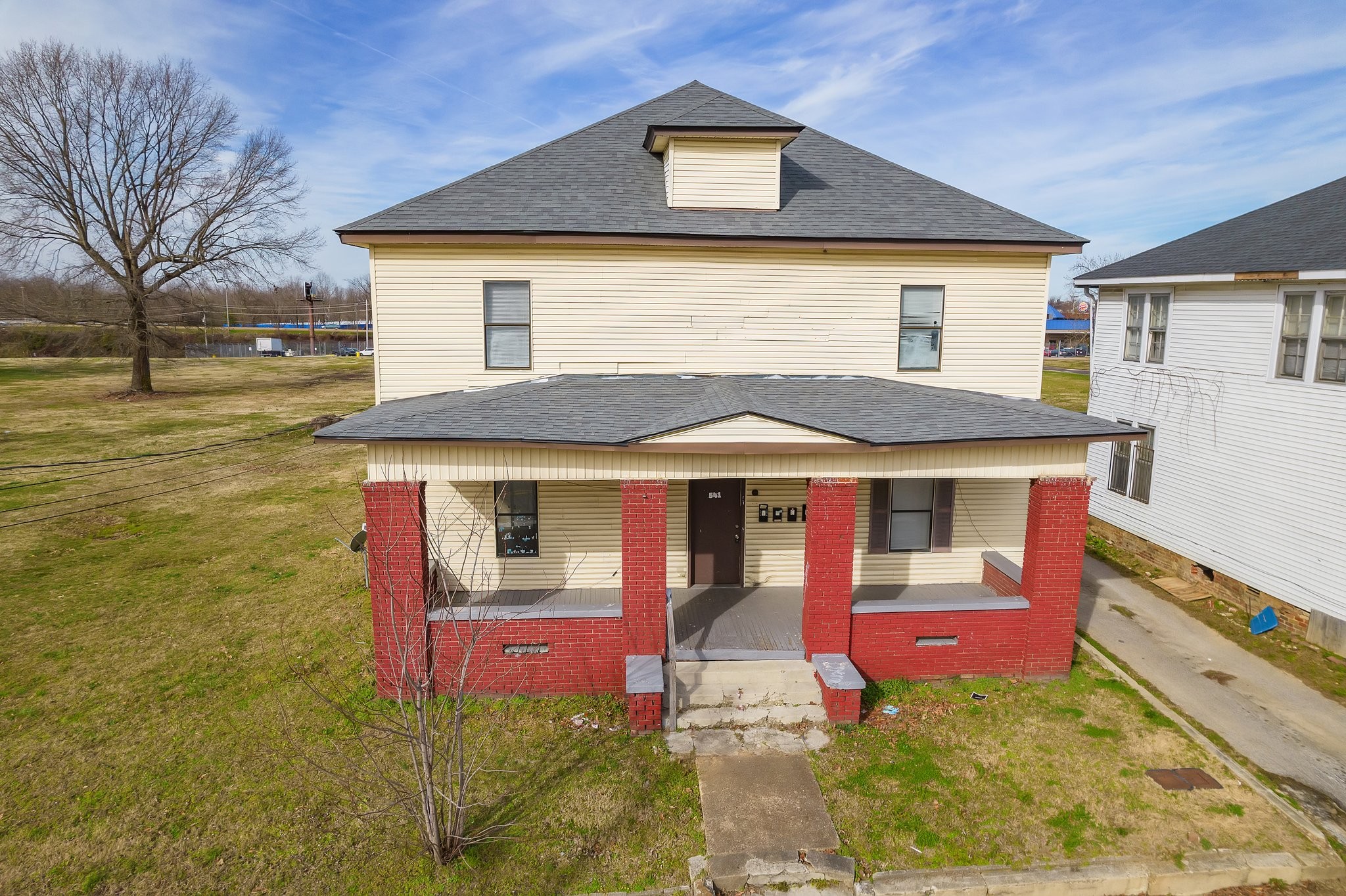 a front view of a house with yard