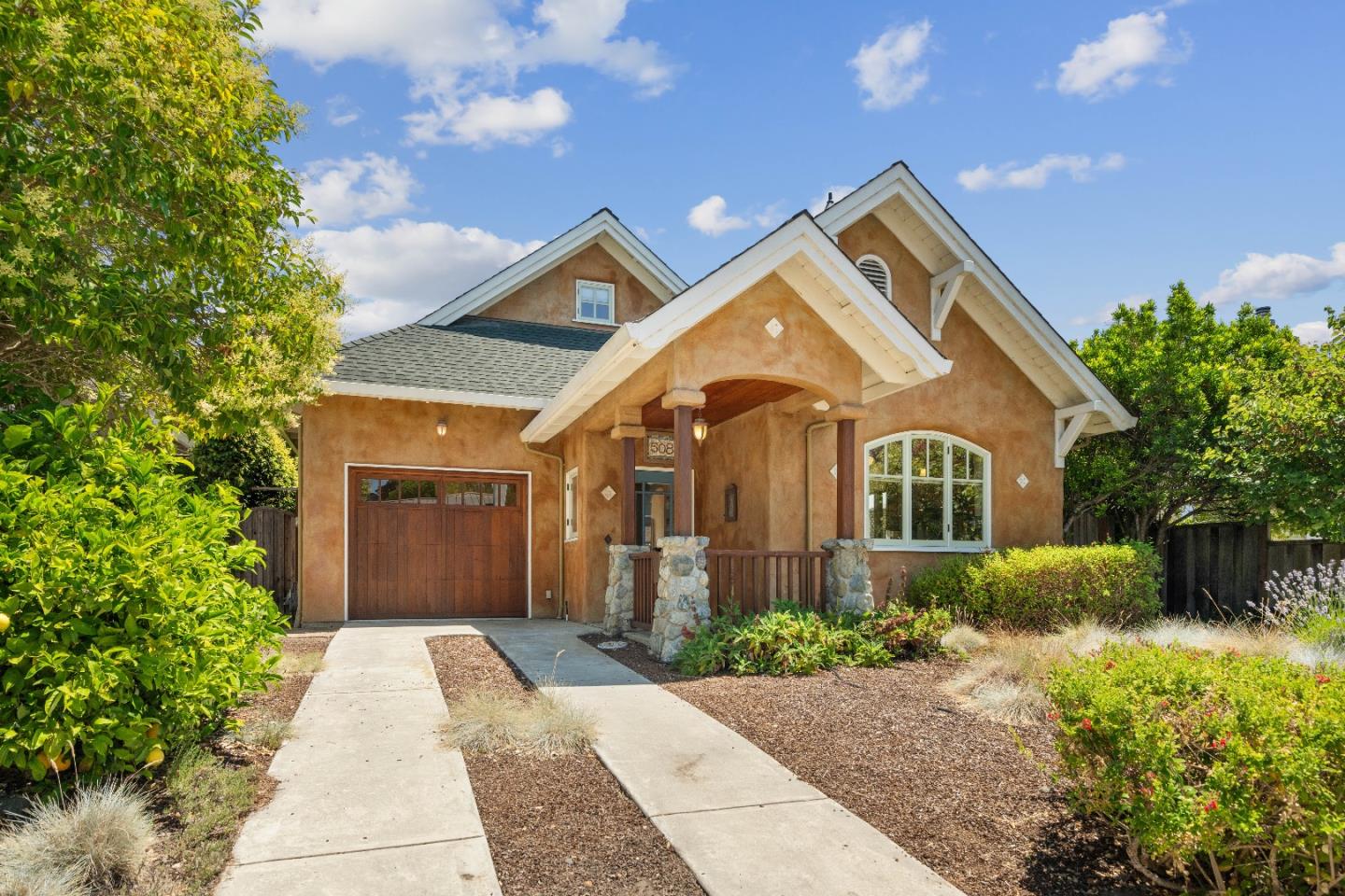 a front view of a house with garden