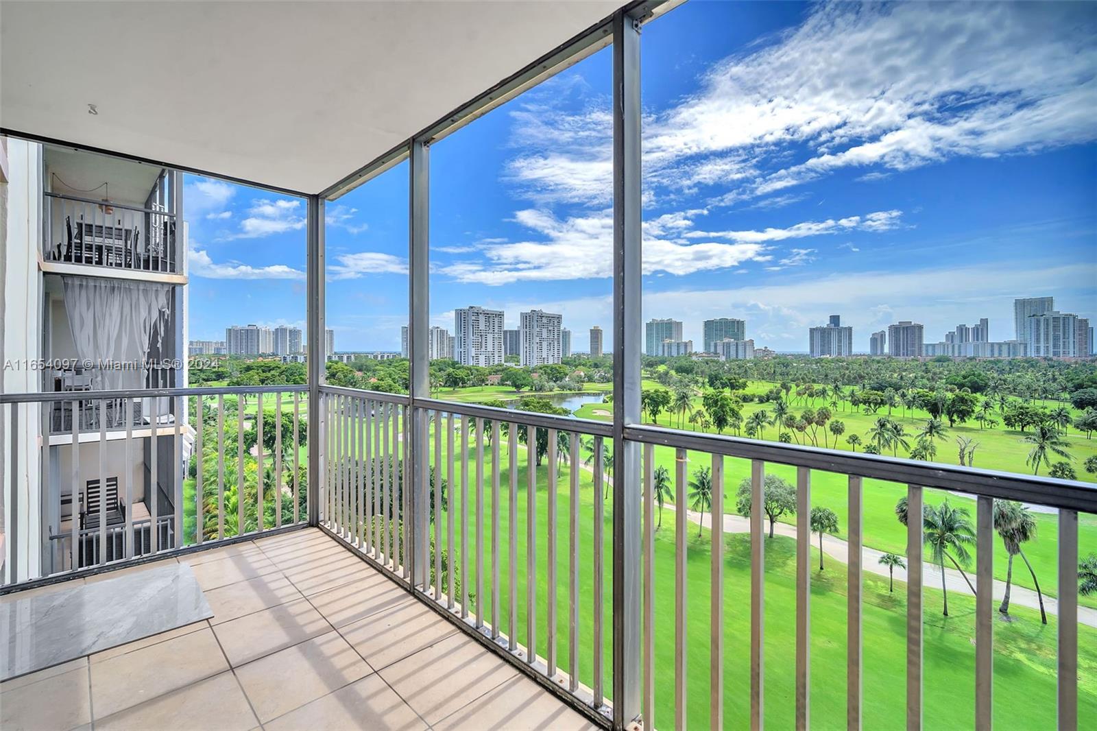 a view of balcony with floor to ceiling windows with wooden floor