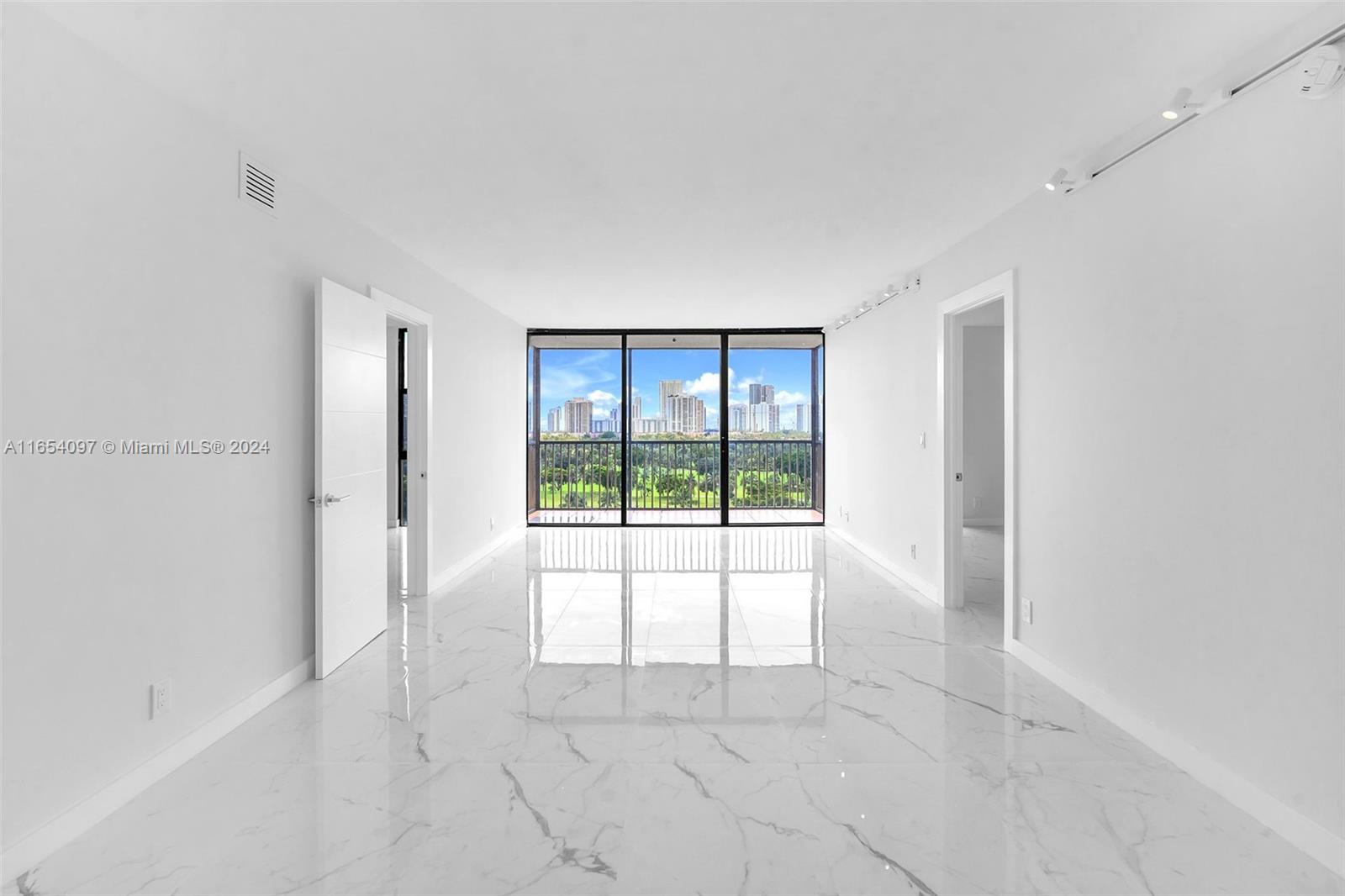 a view of an empty room and window