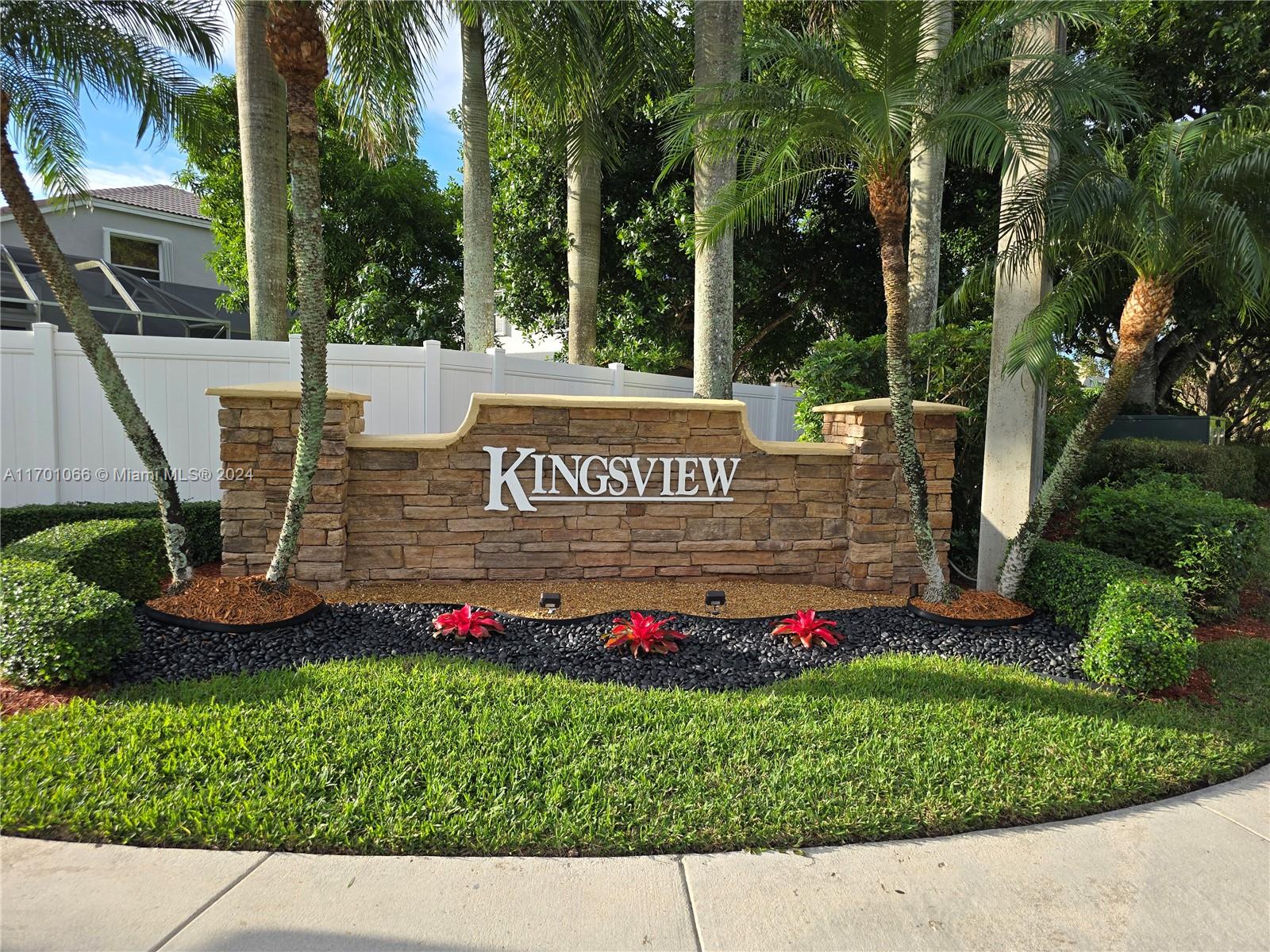 a view of sign board with a yard