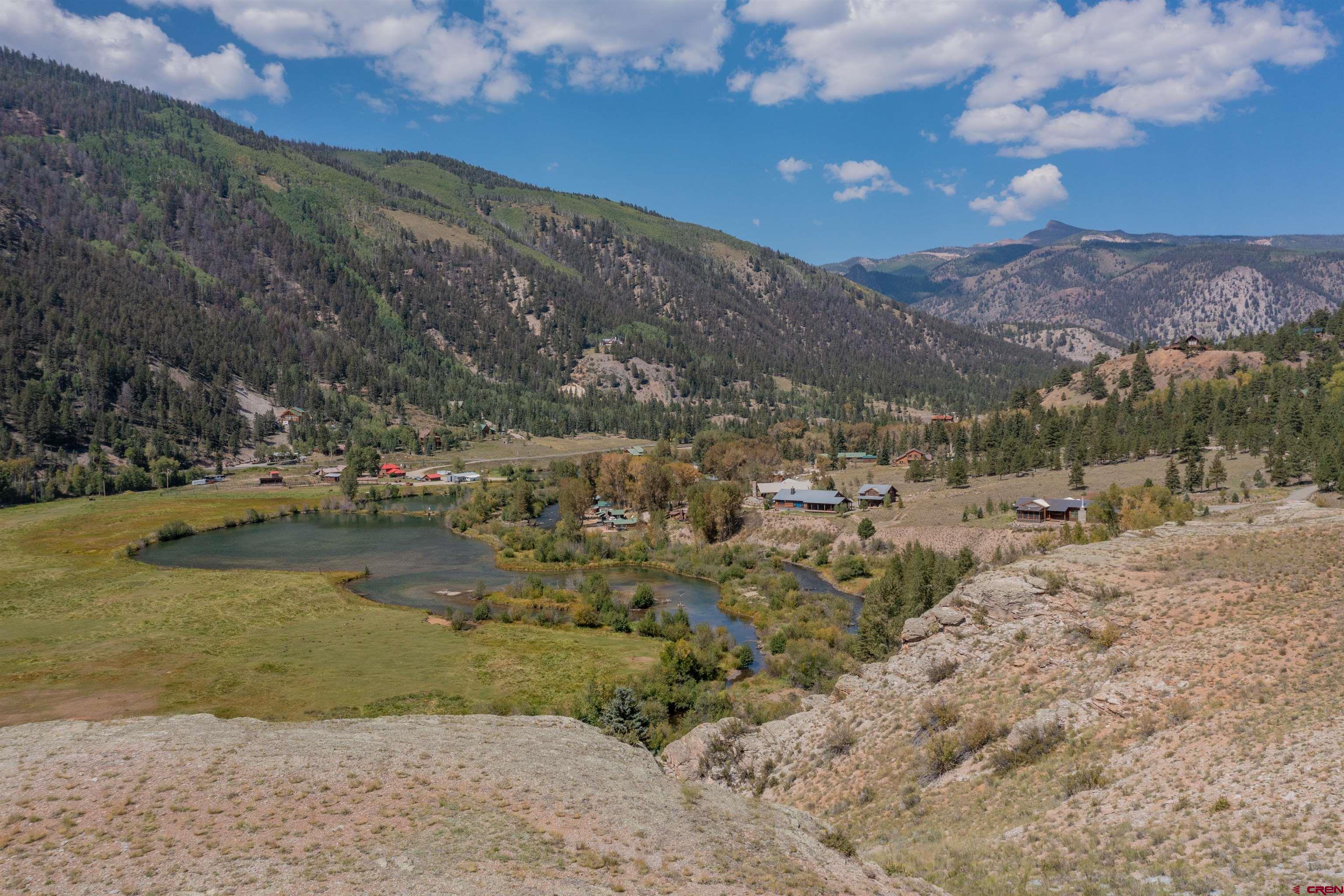 a view of a lake with mountains in the background