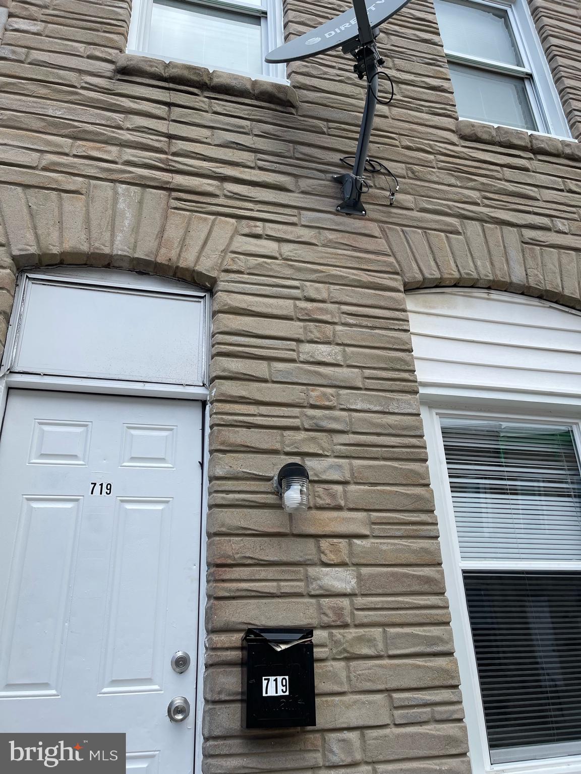 a view of a door of a house with a street