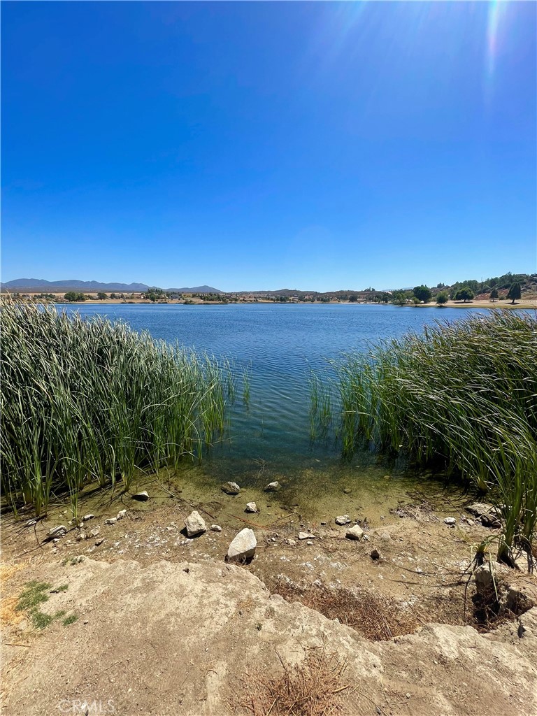 a view of a lake with a yard