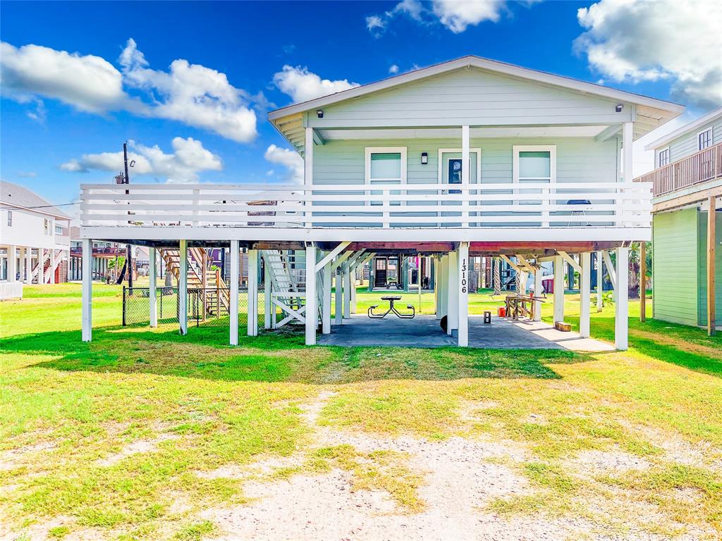 a view of a house with a yard porch and sitting area