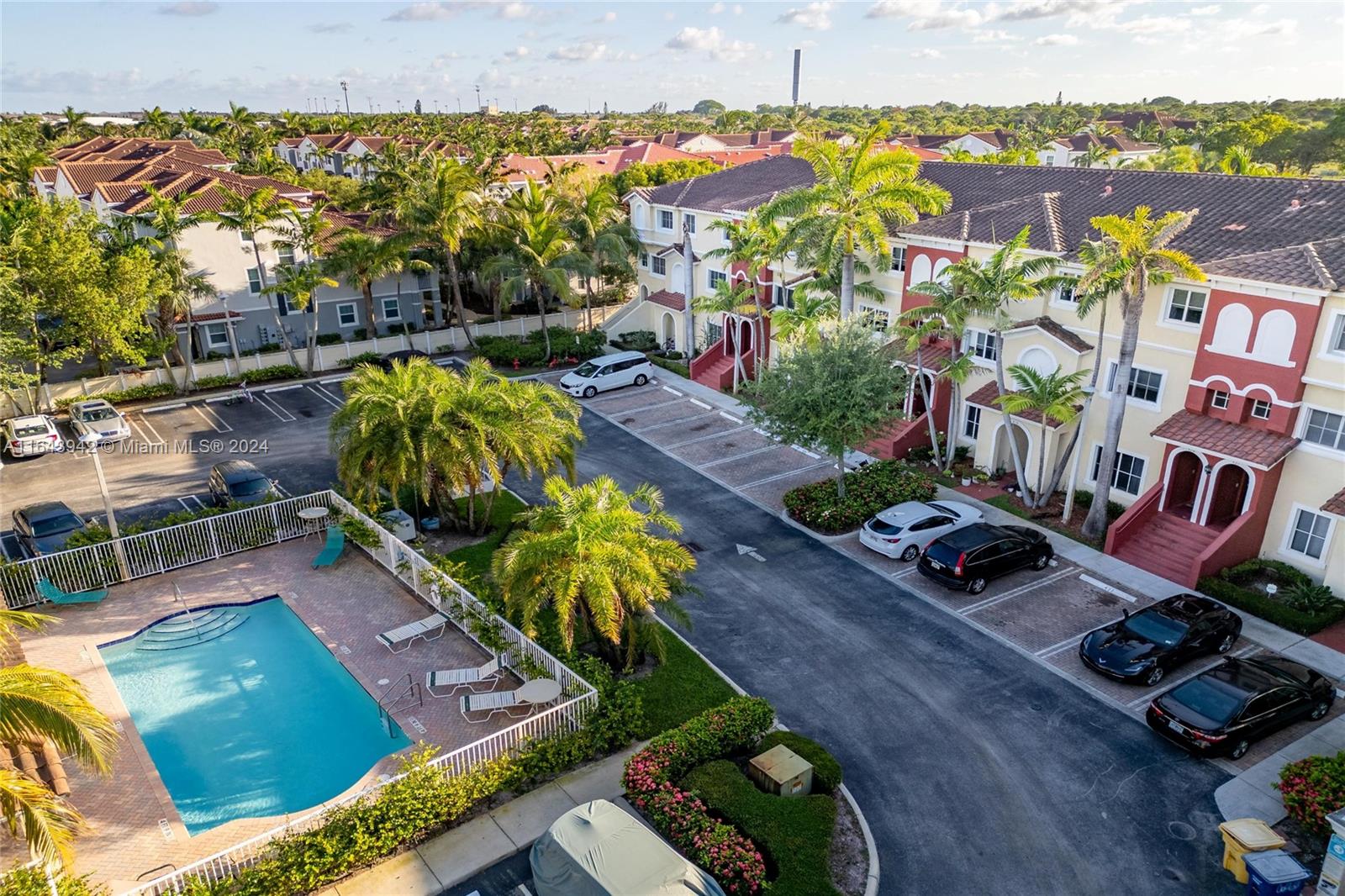 an aerial view of a house a yard swimming pool and outdoor seating