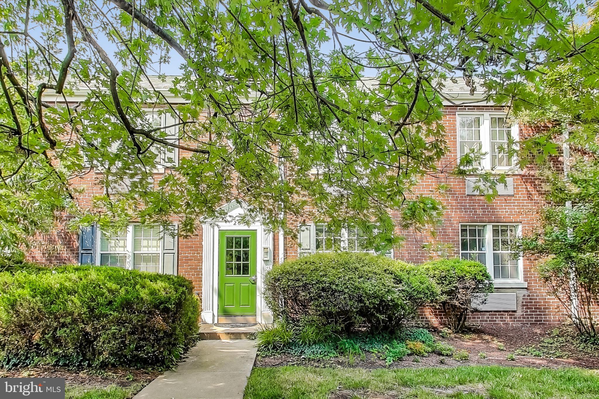 front view of a house with a garden