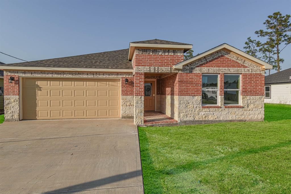 front view of a house with a yard