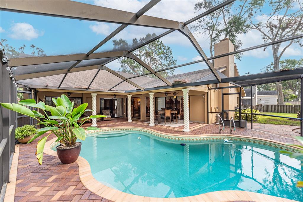 a view of a house with backyard from a patio