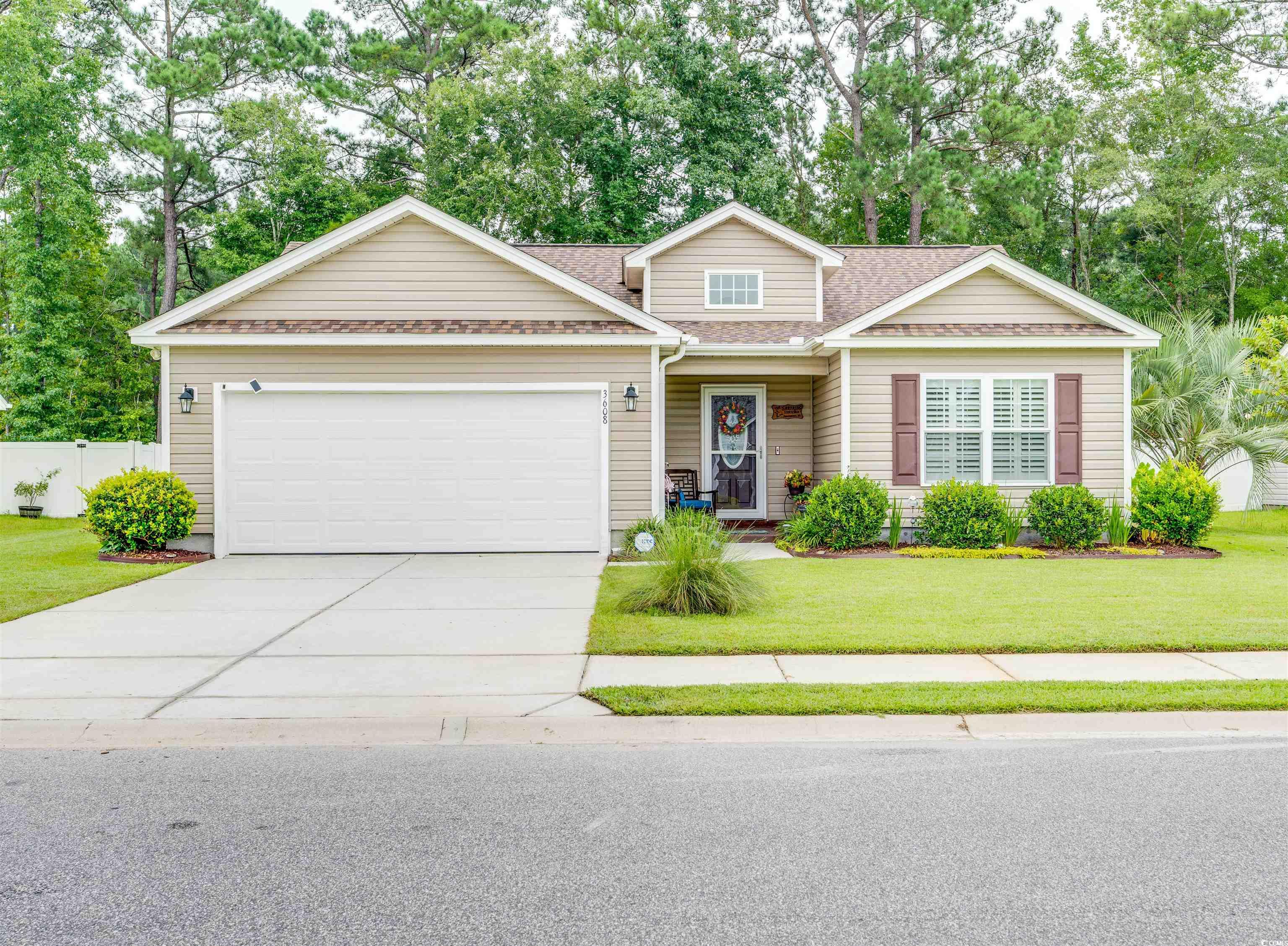 View of front of house featuring a garage and a fr