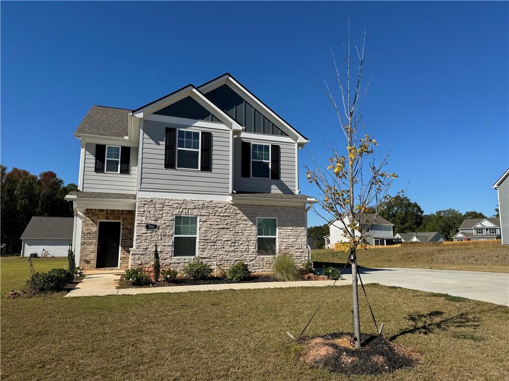 a front view of a house with a yard