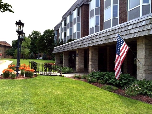 a view of a house with sitting area and garden