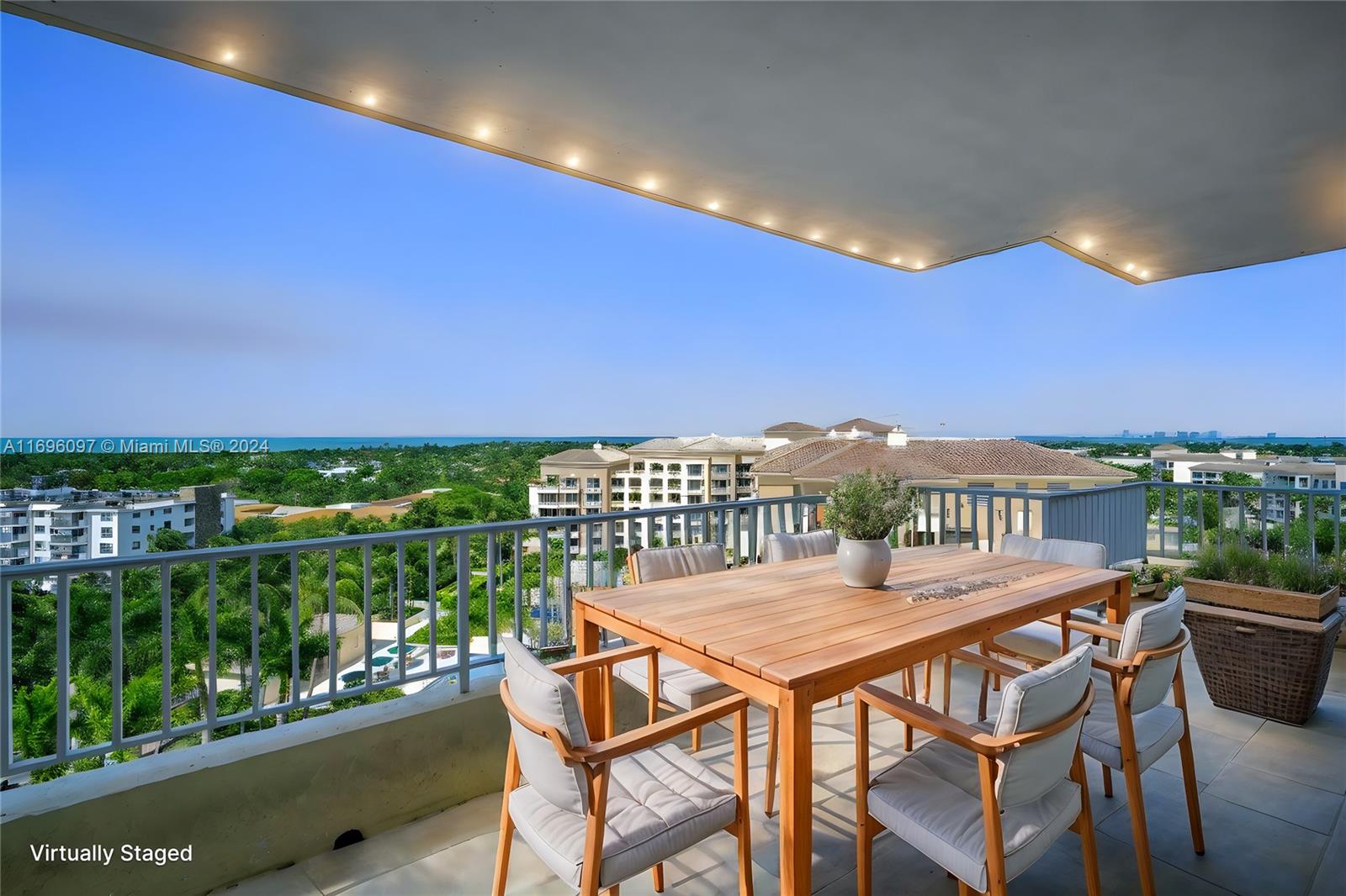 a view of a balcony with table and chairs