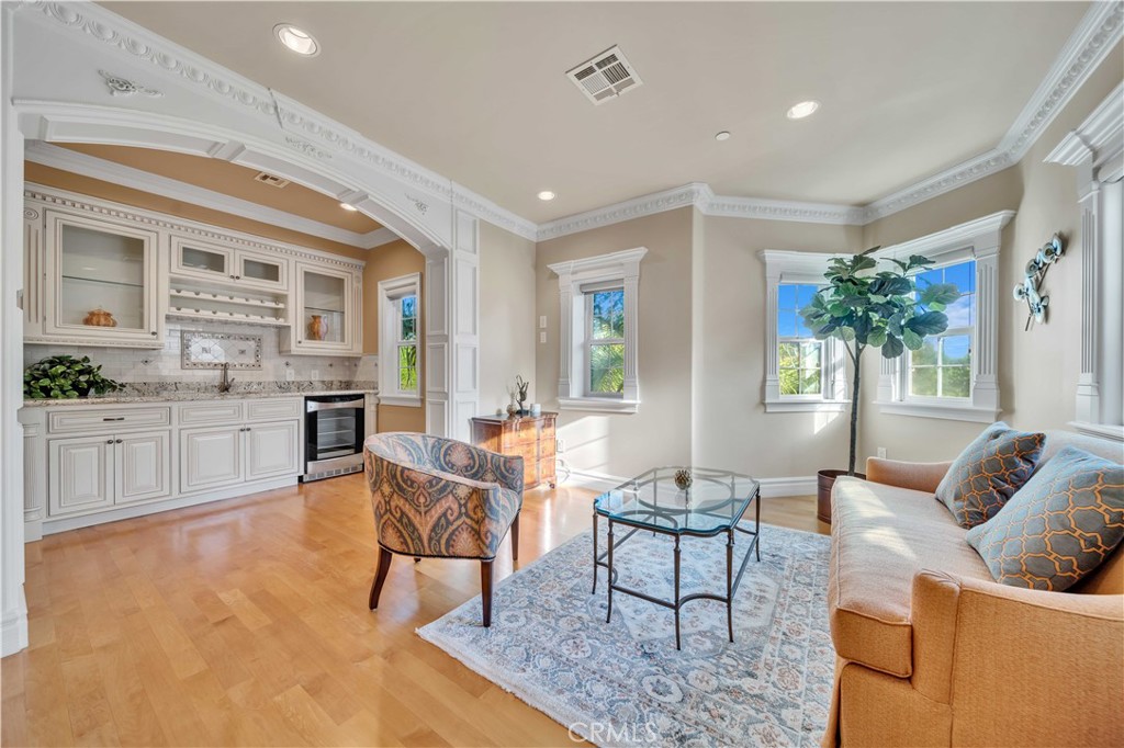 a living room with furniture and a dining table