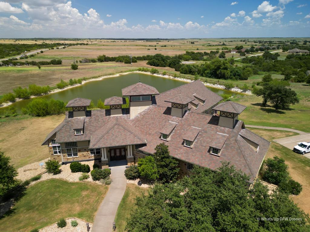 an aerial view of a house with a lake view