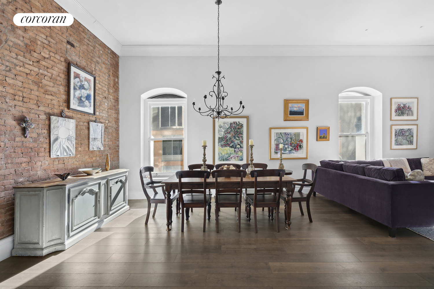 a view of a dining room with furniture window and wooden floor