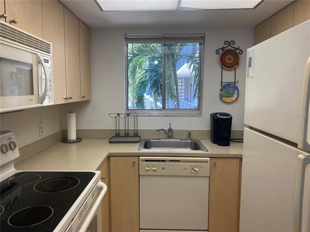 a kitchen with a stove and a sink