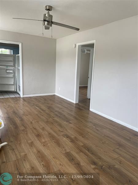 a view of a big room with wooden floor and closet