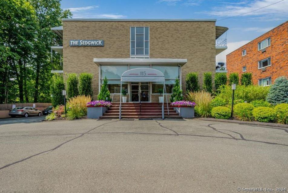 a front view of a building with garden