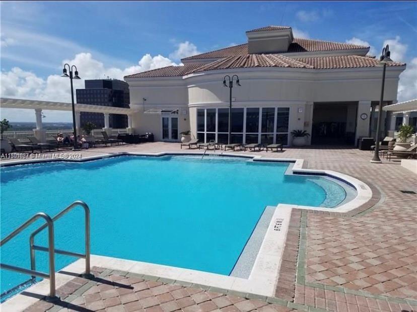 a view of a house with swimming pool patio and a yard