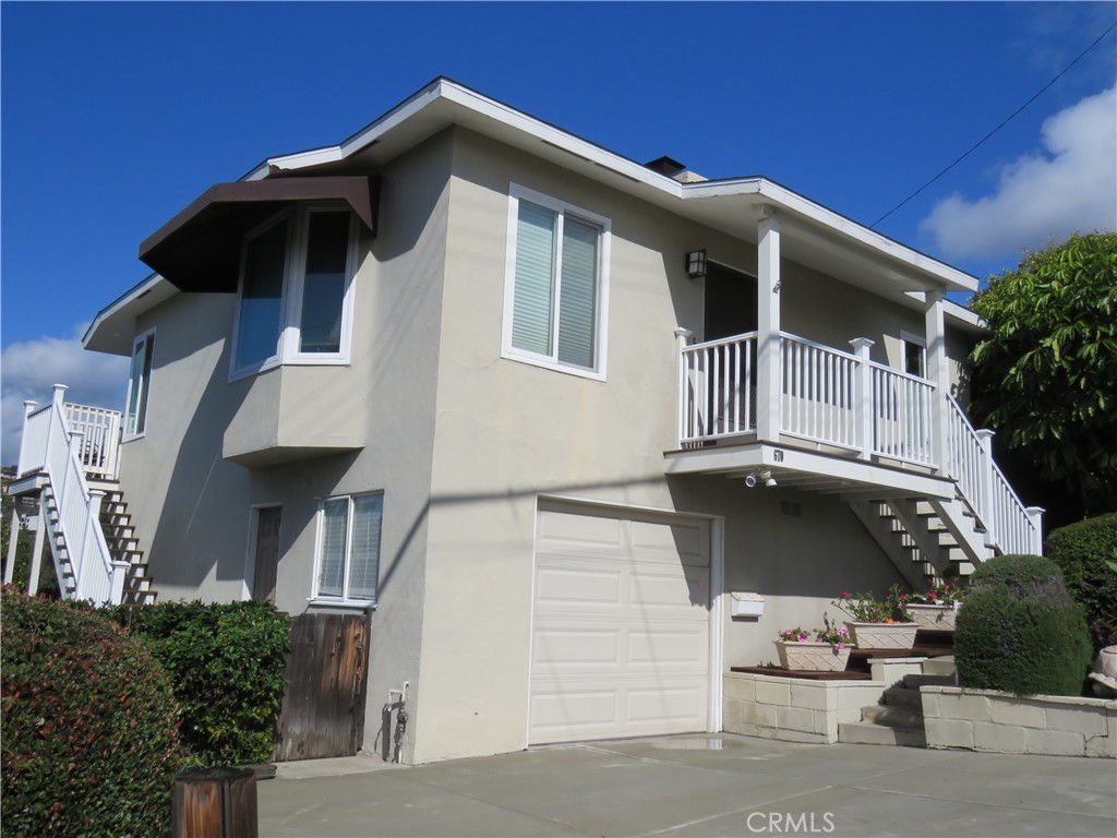 a front view of a house with garage