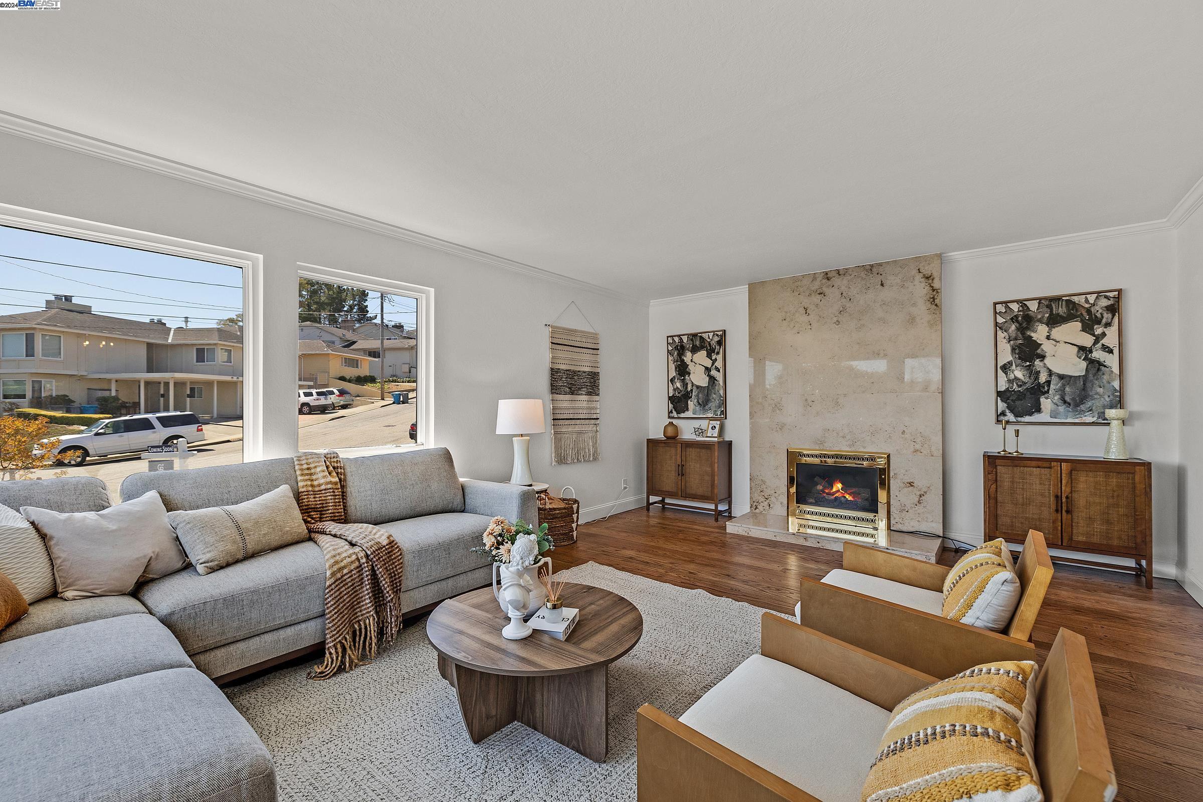 a living room with furniture and a fireplace