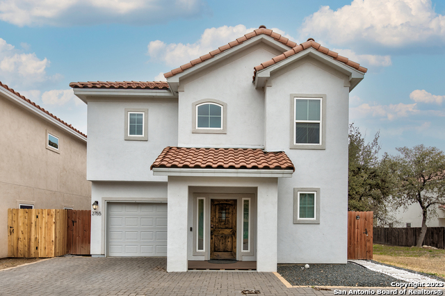 a front view of a house with a garage