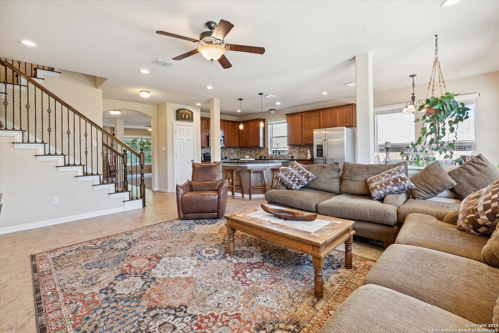 a living room with furniture or kitchen view and a chandelier