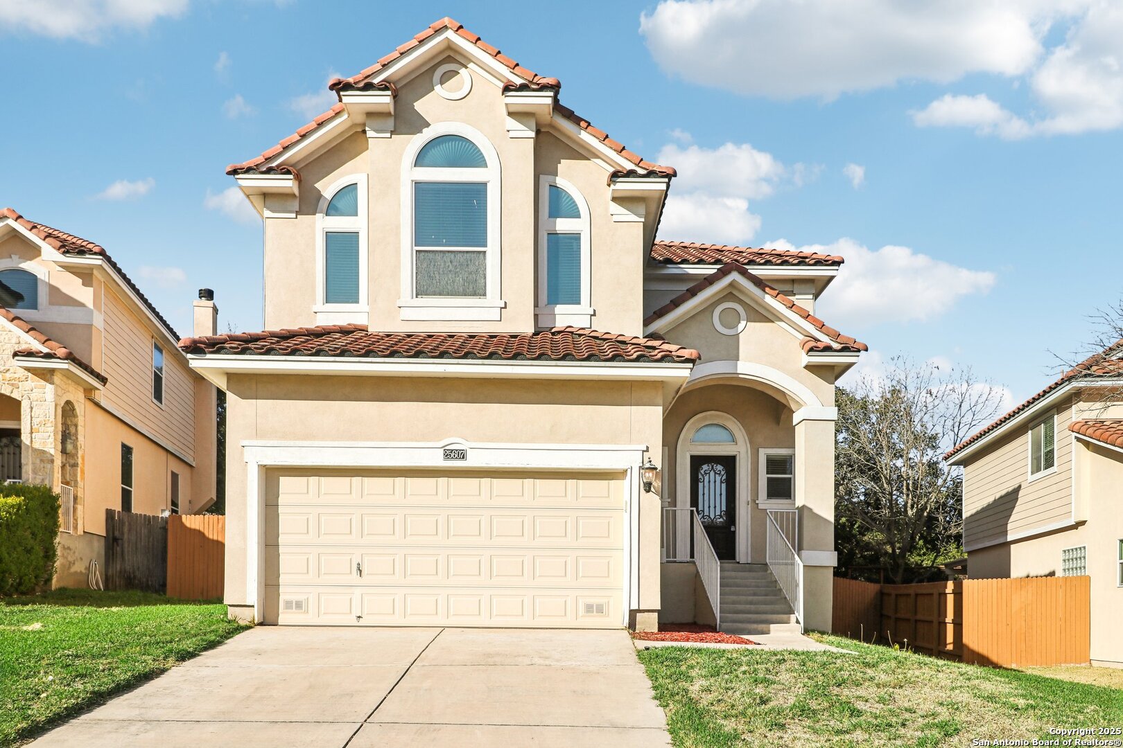 a front view of a house with a yard