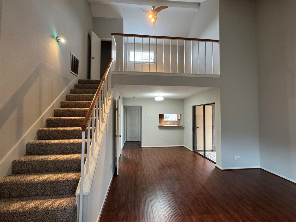 a view of an entryway with wooden floor