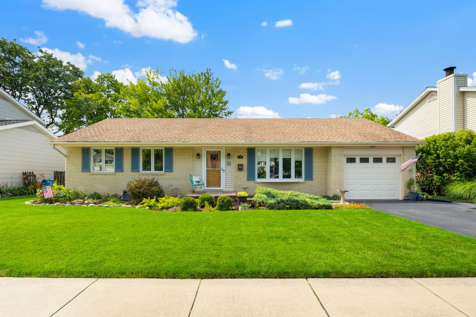 a view front of house with a garden