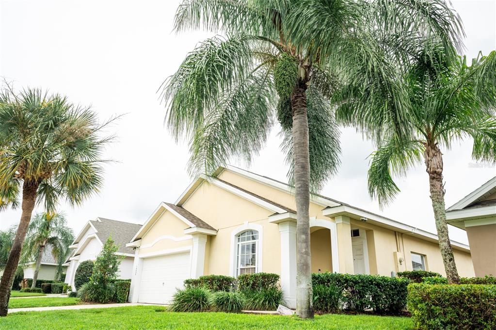 a front view of a house with a garden