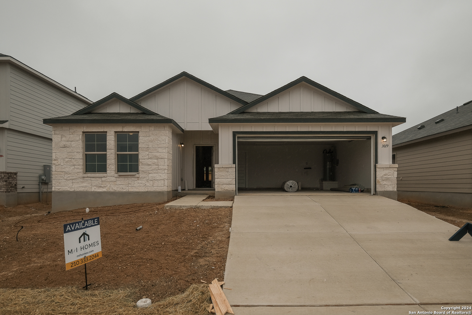 a front view of a house with yard